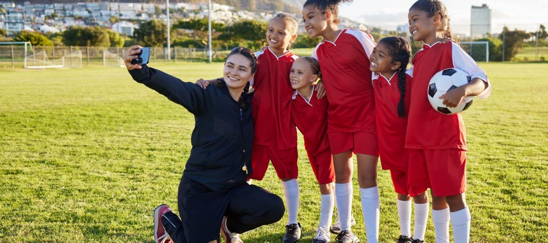 Soccer, team and coach selfie with phone on a field after training, practice or game at a sports cl.